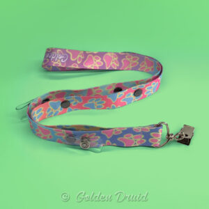 melty paws ultimate badge lanyard furry convention accessory in pastel pink blue yellow design pattern with multiple clips